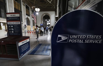 Chief of U.S. Postal Service says to suspend agency reform until after election