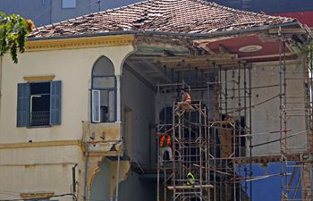 Workers repair buildings damaged in Beirut explosions