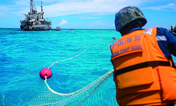 中国海警将菲律宾非法所得渔网收回并送归中国渔民