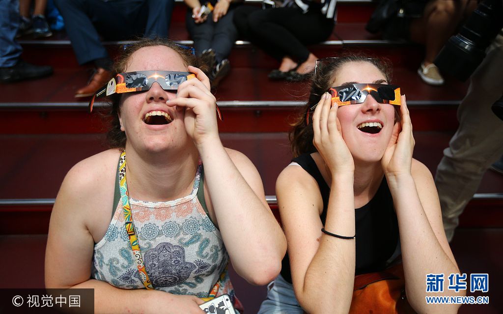 ***_***NEW YORK, USA - AUGUST 21: People gather to observe the total solar eclipse with solar eclipse glasses at the Times Square in New York City, United States on August 21, 2017. (Photo by Volkan Furuncu/Anadolu Agency/Getty Images)